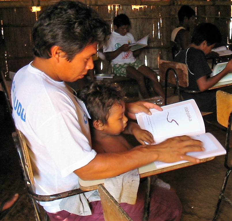 Reading the first Kotiria storybook in 2004